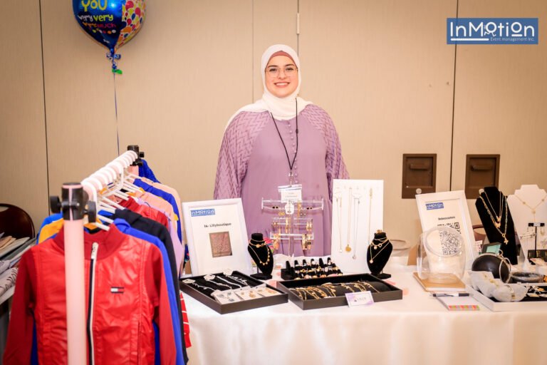 Vendor with her clothing and jewellery booth